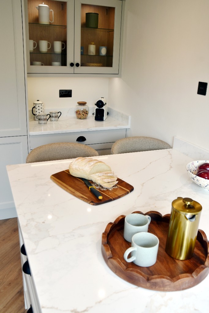 In-frame cabinetry with glass-front wall cupboards