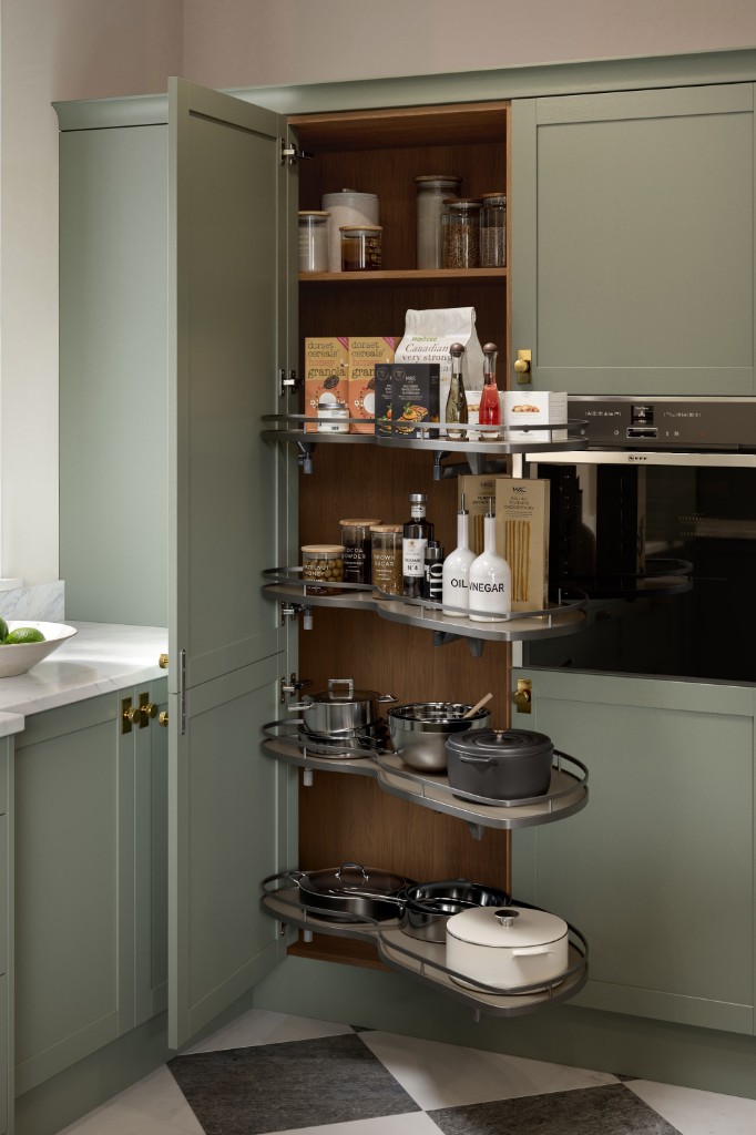 Jade cabinetry with oak pantry interior and pull-out storage